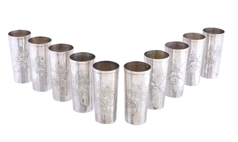 Inline Image - Lot 192, a set of ten Italian silver coloured beakers by Brandimarte, Florence, post 1968, embossed with berries or flowers; est. £300-500 (+fees)