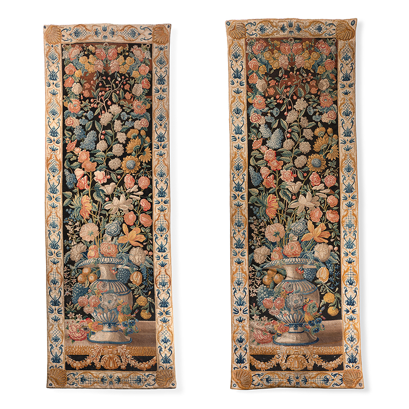 A fine pair of needlework 'Mille Fleurs' hangings, possibly Italian or Portuguese, early 18th century