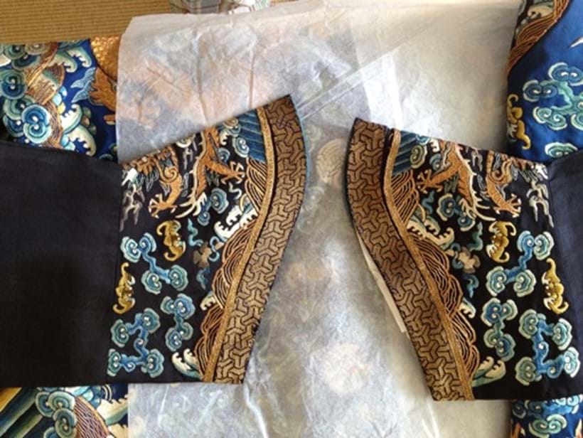 Inline Image - 19th century blue dragon robe wrapped with acid free tissue | Photograph Courtesy of Linda Wrigglesworth Private Collection, London