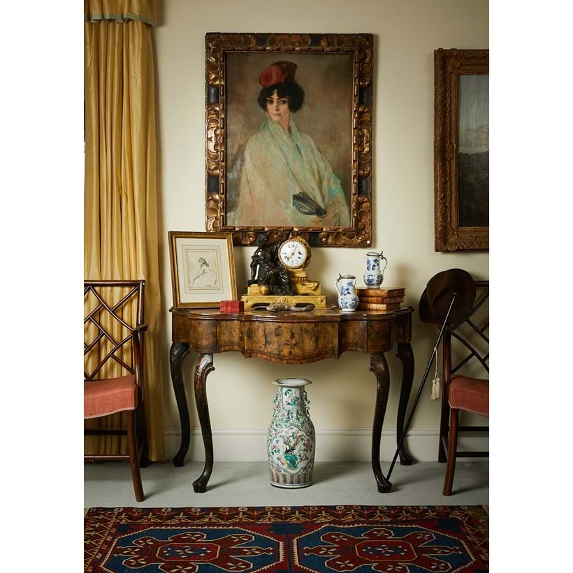 Inline Image - Interior from Oakley House featuring one of a near pair of North Italian walnut and olivewood serpentine side tables, mid-18th century
Provenance: Tyntesfield: Est. £5,000-8,000 (+ fees)