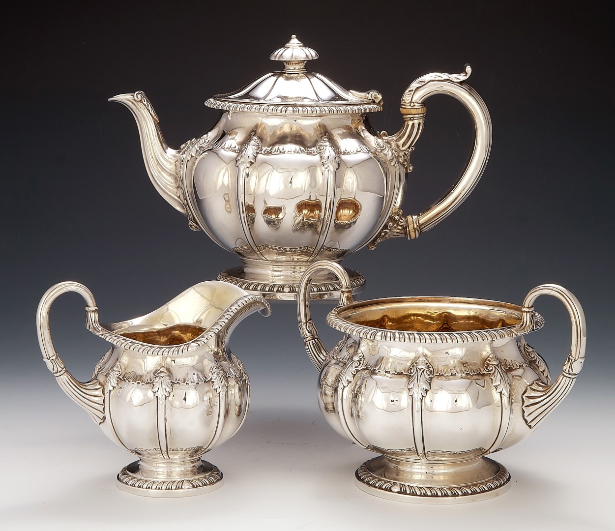 A George IV silver three piece tea service by Paul Storr, London 1822 and 1823
