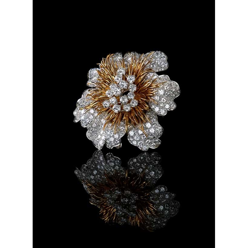 Inline Image - Lot 206: A 1970s 18 carat gold and diamond flower head brooch by Kutchinsky | Est. £10,000-15,000 (+fees)