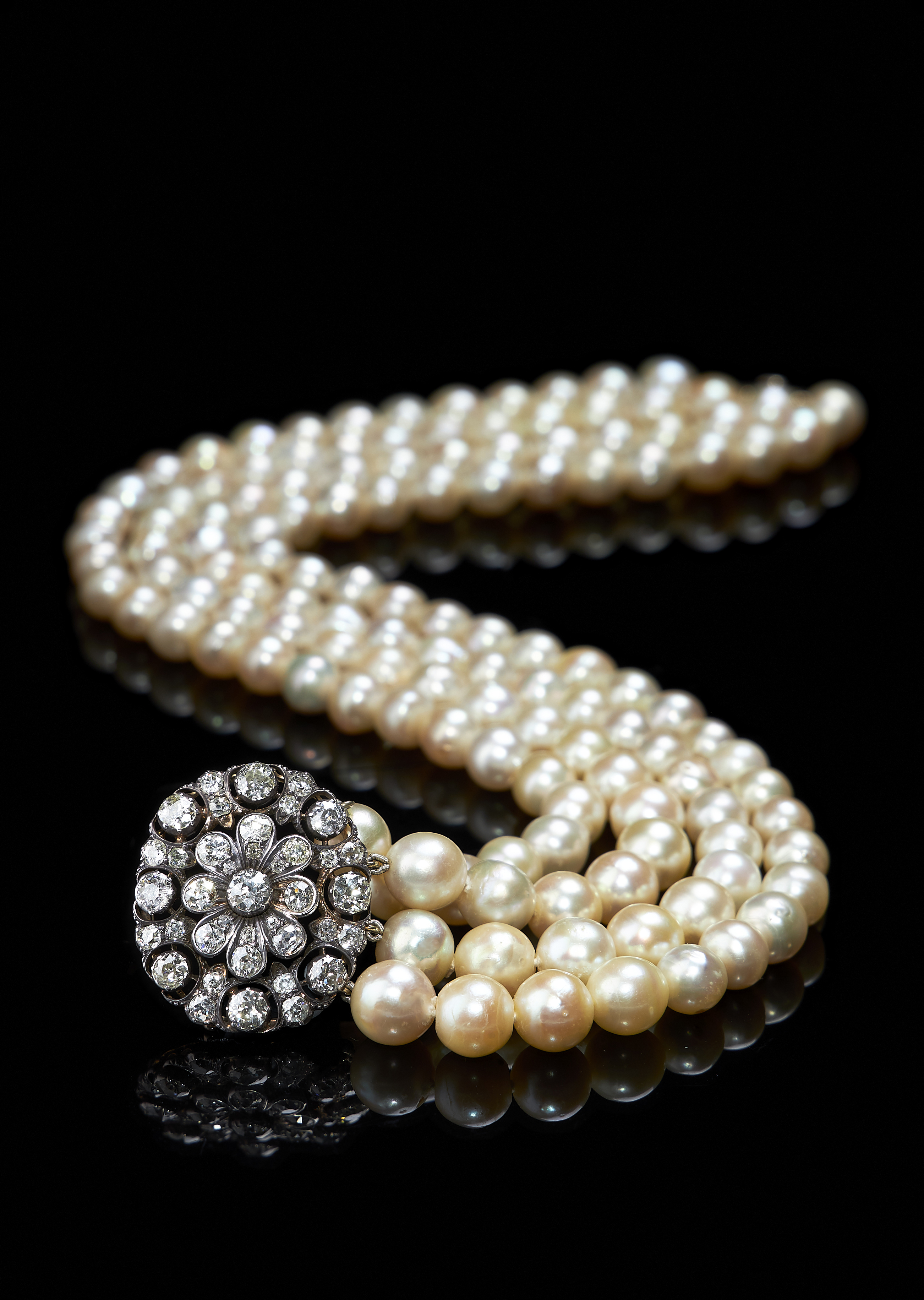 Inline Image - Lot 86: A cultured pearl four row necklace with Victorian diamond clasp | Est. £3,000-5,000 (+fees)