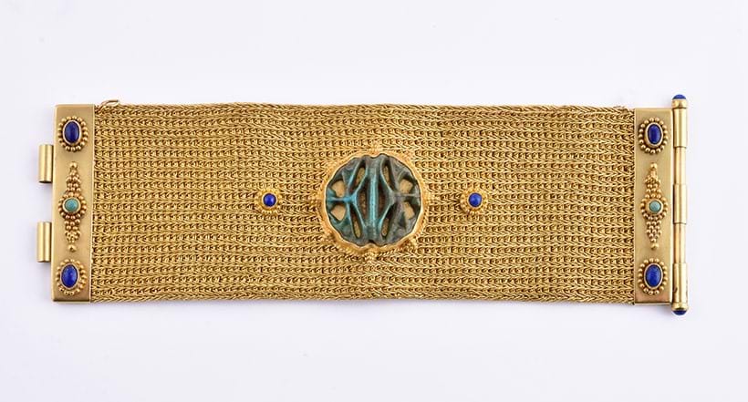 Inline Image - Gold mesh bracelet with an Egyptian faience of the Multiple Eyes of Horus, 19th Dynasty, 1305 – 1080BC (originally exhibited Tambaran Gallery, New York November 1989 – January 1990)