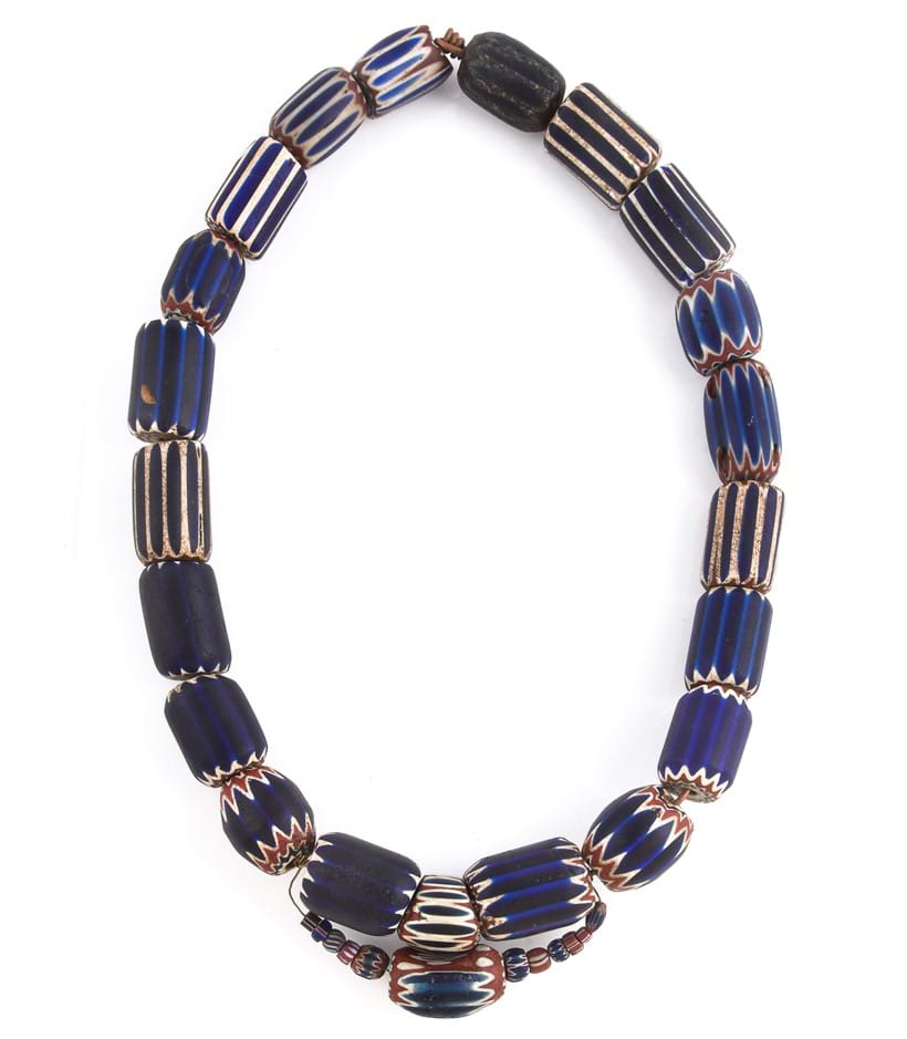 Inline Image - A chevron glass bead necklace, composed of blue, red and white chevron glass beads, of varied size, 27cm long, with three loose chevron beads