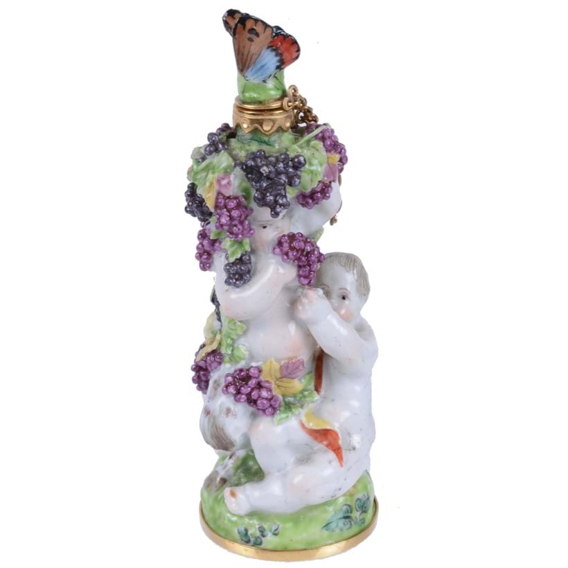 Inline Image - Lot 55: A Charles Gouyn St. James's factory type scent bottle and stopper of Bacchic putti with a faun, circa 1755, butterfly stopper | Est. £1,500-2,500 (+fees)