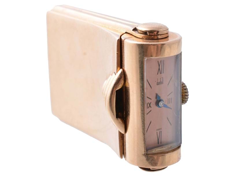 Inline Image - Lot 129: Dunhill, an 18 carat gold travel/dressing table watch, import mark for London 1939. Property from the estate of the late Betty, Lady Grantchester | Est. £600-800 (+fees)