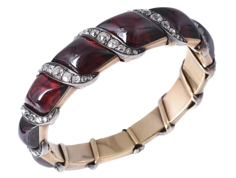 Inline Image - Lot 142: A mid 19th century garnet and diamond bangle, circa 1860 | Est. £2,500-3,500 (+fees)