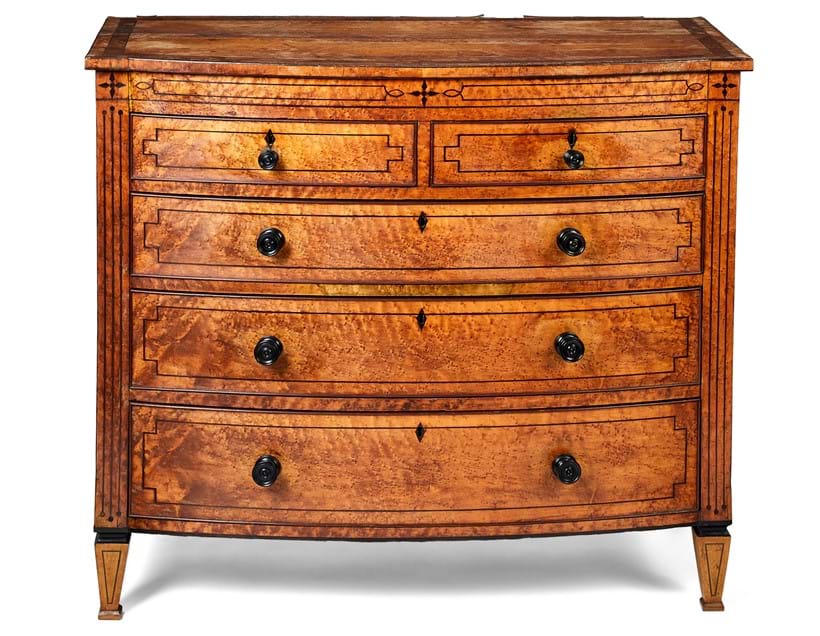 Inline Image - The Collection of Sir William Whitfield CBE, 10 March | A Regency 'bird's eye Maple' bow-front and inlaid chest of drawers, circa 1810 | Sold for £3,250
