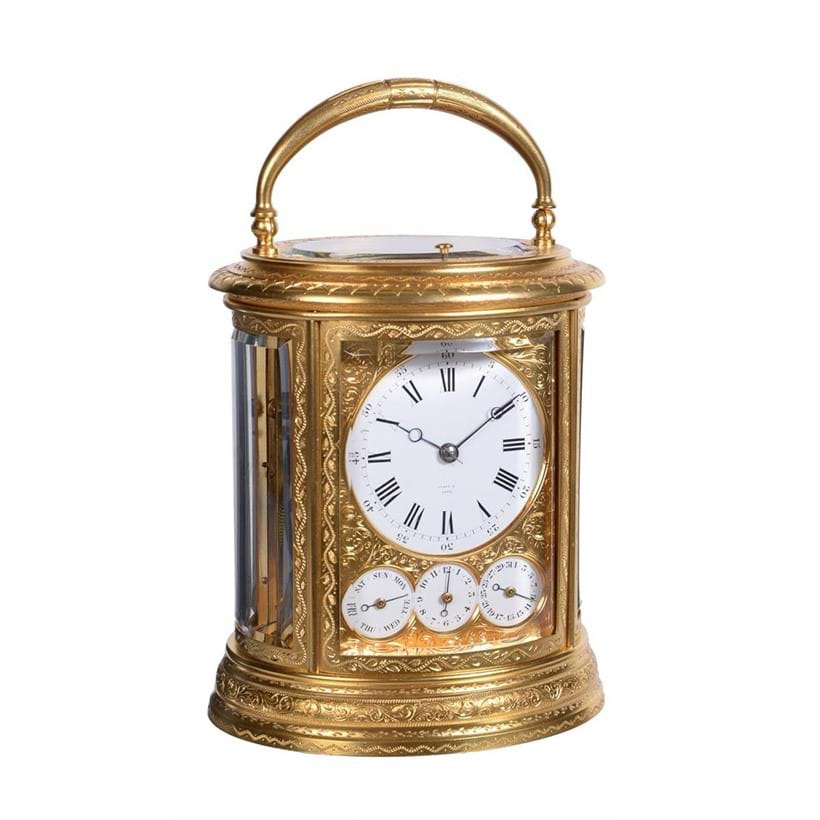 Inline Image - Lot 99: A fine engraved gilt brass oval grande-sonnerie striking calendar carriage clock with push-button repeat and alarm, Drocourt, Paris for retail by Tiffany and Company, third quarter of the 19th century | Est. £4,000-6,000 (+fees)