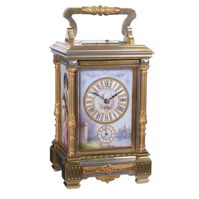 Inline Image - Lot 131: A fine French porcelain panel inset silvered and gilt brass grande-sonnerie striking carriage clock with push-button repeat and alarm, Retailed by Tiffany and Company with panels by Lucien Simonnet, Paris late 19th century | Est. £3,000-4,000 (+fees)
