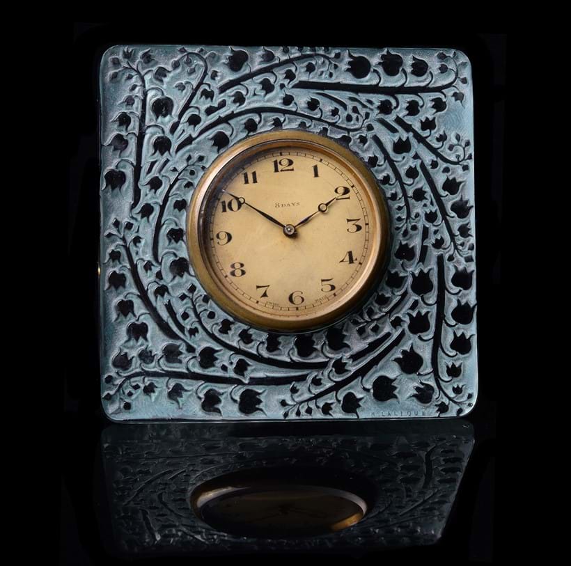 Inline Image - Lot 100: Lalique, René Lalique, Muguet, a green stained glass small clock (pendulette)