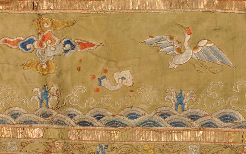 Inline Image - Figure 4: (Detail) A crane in flight embroidered on the priest’s robe
