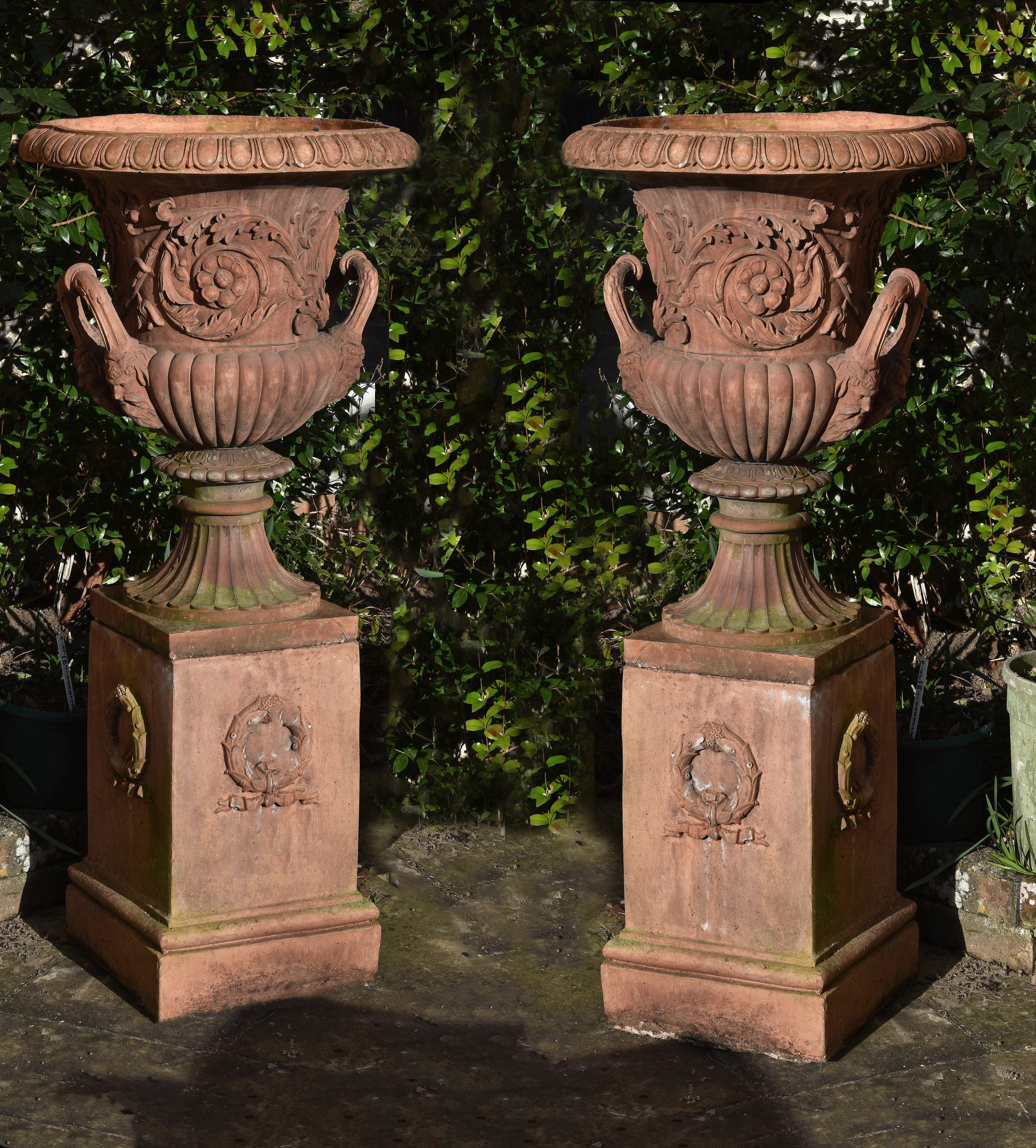 Inline Image - A pair of terracotta garden urns on plinths, second half 20th century Lot 161, 28 June 2018, sold for £2,232 incl. premium