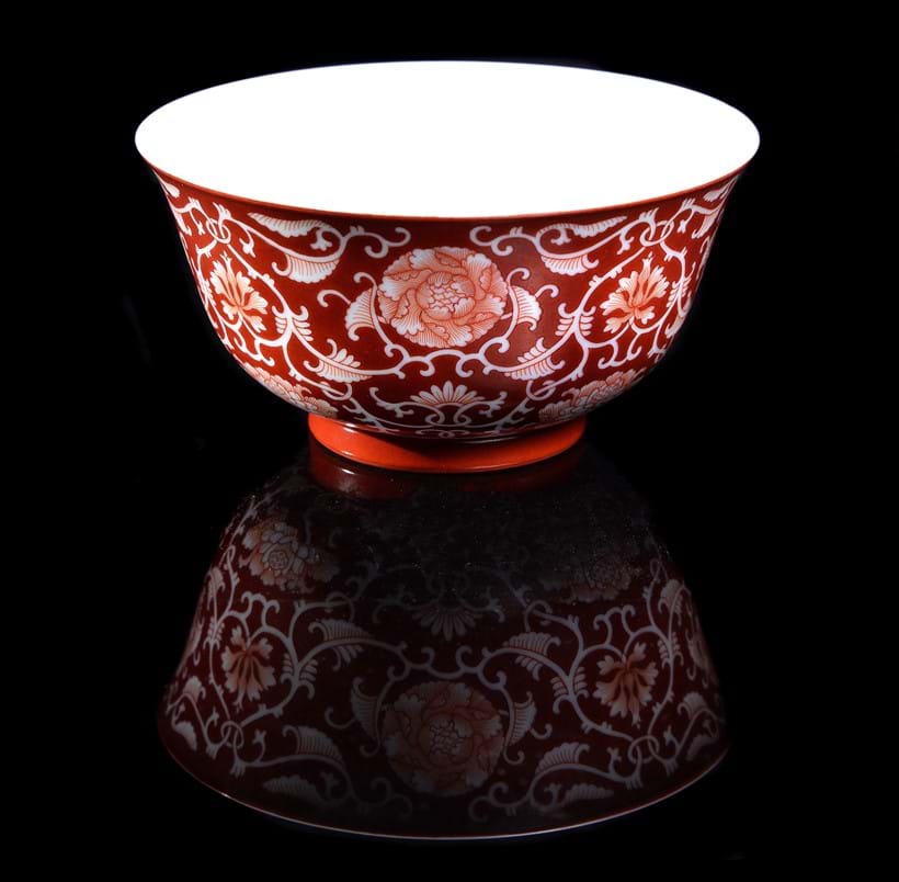 Inline Image - Lot 355: A Chinese coral-ground reserve decorated 'Lotus' bowl, seal mark and period of Qianlong (1735-1796), 13cm diameter | Est. £6,000-8,000 (+fees)