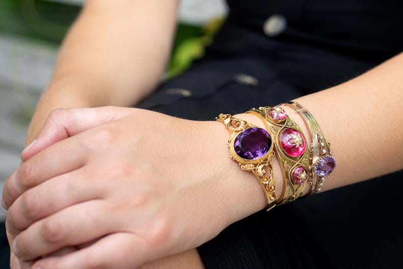 Inline Image - Lot 230: An amethyst and half pearl hinged bangle | Est. £80-120 (+fees); Lot 231: A late Victorian gold, foiled quartz and half pearl hinged bangle, circa 1880 | Est. £300-500 (+fees); A late Victorian amethyst hinged bangle, circa 1900 | Est. £300-500 (+fees)