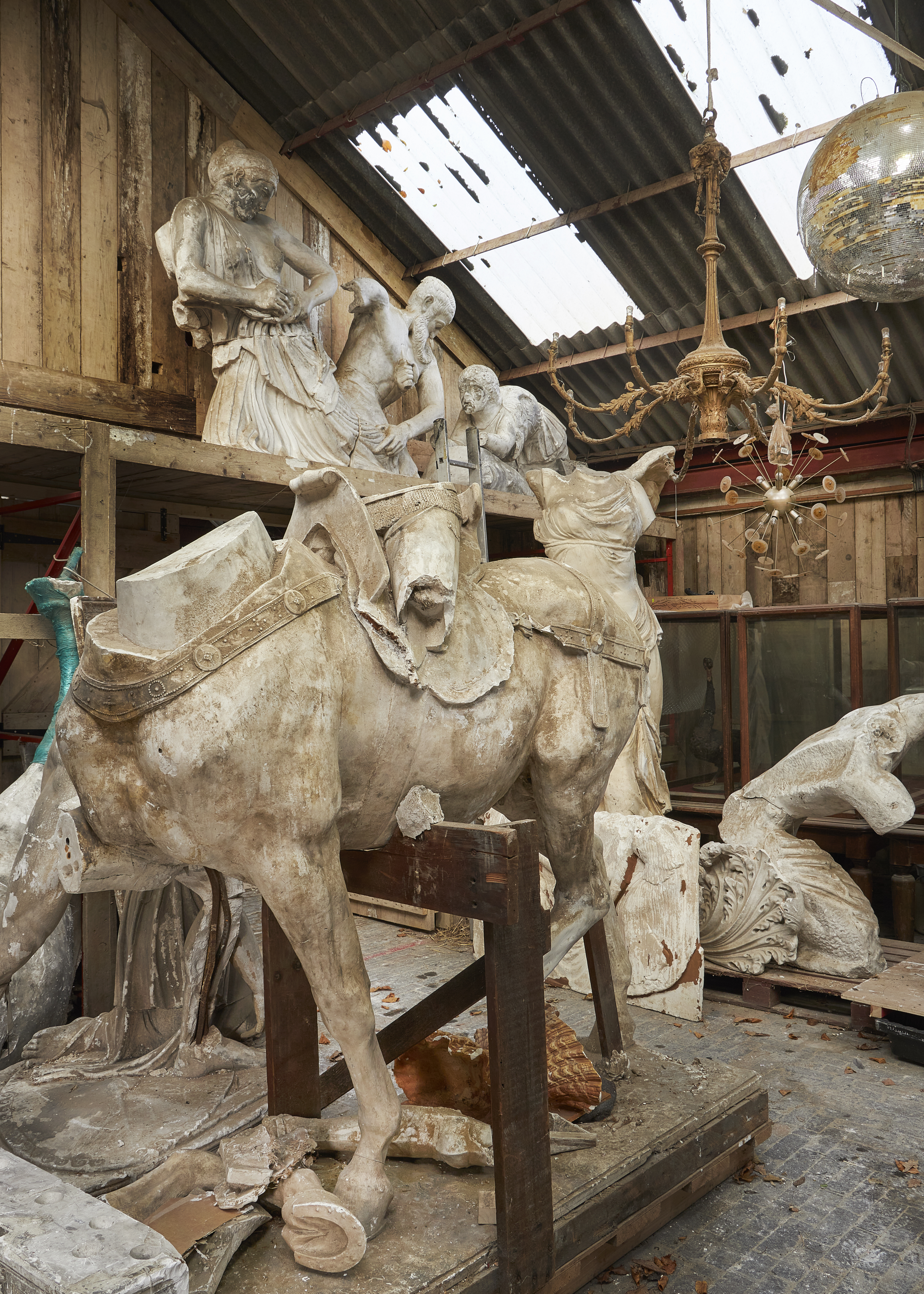 Inline Image - Lot 591: AFTER PAUL DUBOIS (FRENCH, 1829-1905), A LARGE PLASTER SECTION OF THE EQUESTRIAN STATUE OF JOAN OF ARC, LATE 19TH/FIRST HALF 20TH CENTURY, AFTER A CIRCA 1896 ORIGINAL, Fragmentary, showing the body and legs of the horse, with ornamented tack, and a section of the rider, on an integral rectangular plinth inscribed P. DUBOIS to the maquette, 220cm high, 210cm long, 90cm wide | Est. £4,000-6,000 (+fees)