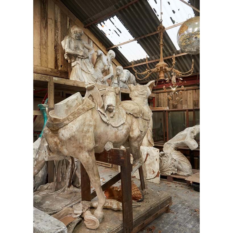 Inline Image - Lot 591: AFTER PAUL DUBOIS (FRENCH, 1829-1905), A LARGE PLASTER SECTION OF THE EQUESTRIAN STATUE OF JOAN OF ARC, LATE 19TH/FIRST HALF 20TH CENTURY, AFTER A CIRCA 1896 ORIGINAL, Fragmentary, showing the body and legs of the horse, with ornamented tack, and a section of the rider, on an integral rectangular plinth inscribed P. DUBOIS to the maquette, 220cm high, 210cm long, 90cm wide | Est. £4,000-6,000 (+fees)