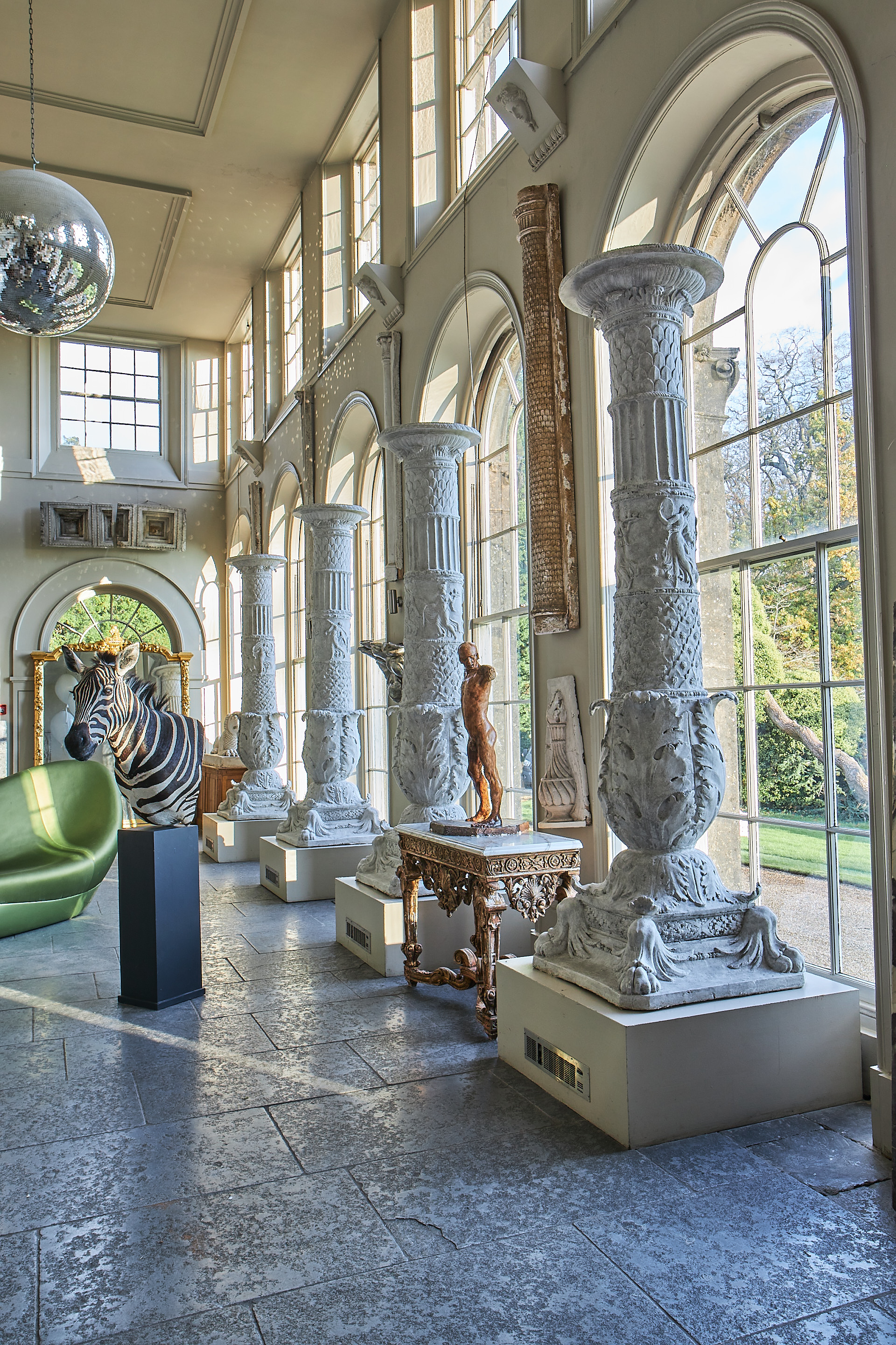 Inline Image - Lot 311: A PAIR OF LARGE PLASTER TORCHERES, AFTER THE ANTIQUE, MODERN, Of baluster form, the stem cast with a figural relief of maidens, probably Maeneads, terminating in acanthus leaves and square paw bases, circa 277cm high | Est. £3,000-5,000 (+fees)