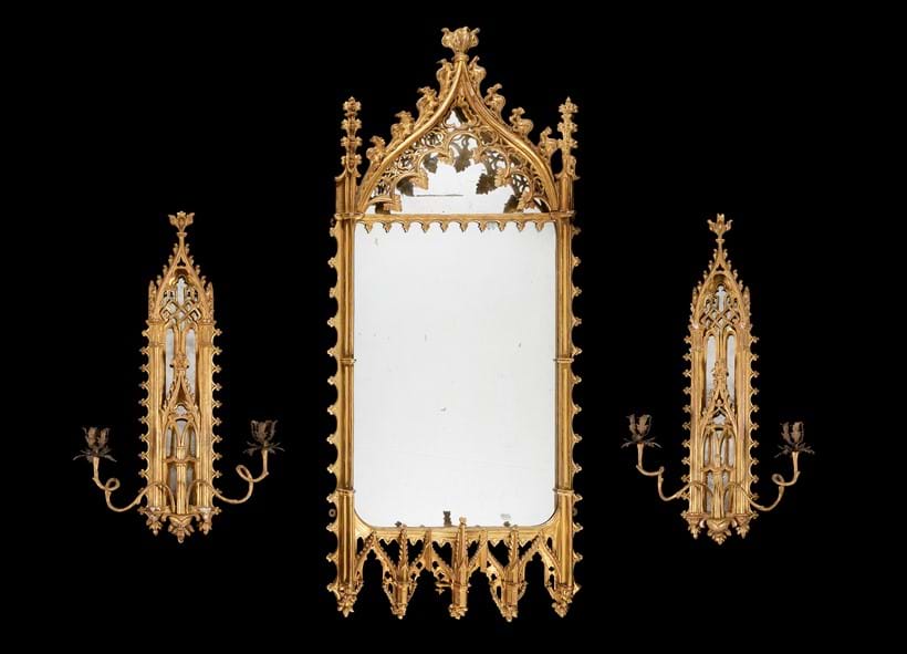 Inline Image - Lot 396: A Gothic Revival carved giltwood mirror and pair of matching girandoles, late 18th or early 19th century | Est. £6,000-8,000 (+fees)