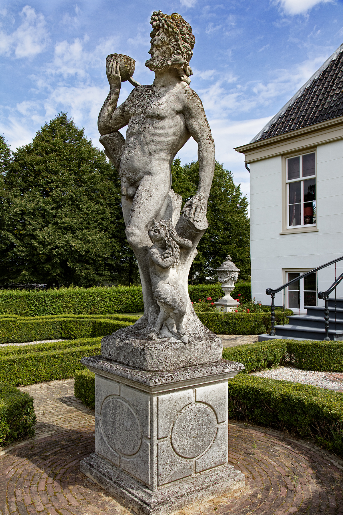 Inline Image - Lot 176: A monumental and impressive Italian sculpted limestone group of Bacchus with a satyr, early 20th century | Est. £25,000-35,000 (+fees)