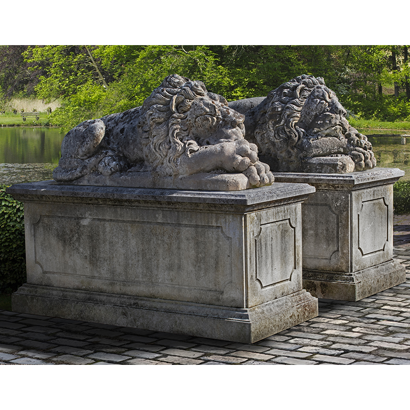 A pair of fine monumental sculpted limestone models of recumbent lions, 20th century, after Antonio Canova (Venetian, 1757-1822)