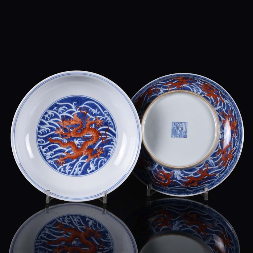 Inline Image - Lot 65: A fine pair of iron-red and underglaze-blue 'Dragon' dishes, Qianlong seal marks and of the period (1735-1796) | Est. £8,000-12,000 (+fees)