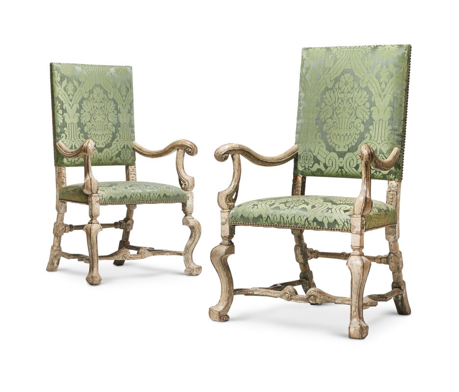 Lot 78: A PAIR OF CARVED WOOD, PAINTED AND SILVERED ARMCHAIRS ONE CIRCA 1700, THE OTHER A LATER COPY