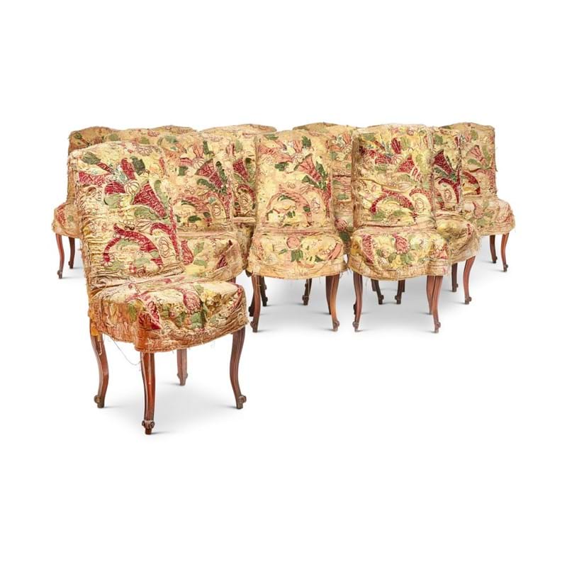 Lot 209: A SET OF FOURTEEN LOUIS XV STYLE WALNUT AND UPHOLSTERED SIDE CHAIRS, 19TH CENTURY