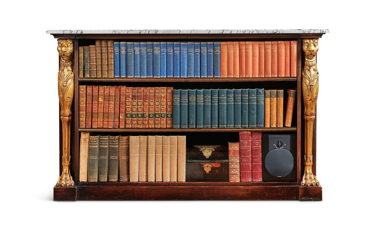 Lot 103: A PAIR OF REGENCY STYLE 'FOSBURY' EBONISED, PARCELGILT AND BRASS-MOUNTED LOW BOOKCASES BY ROBERT KIME