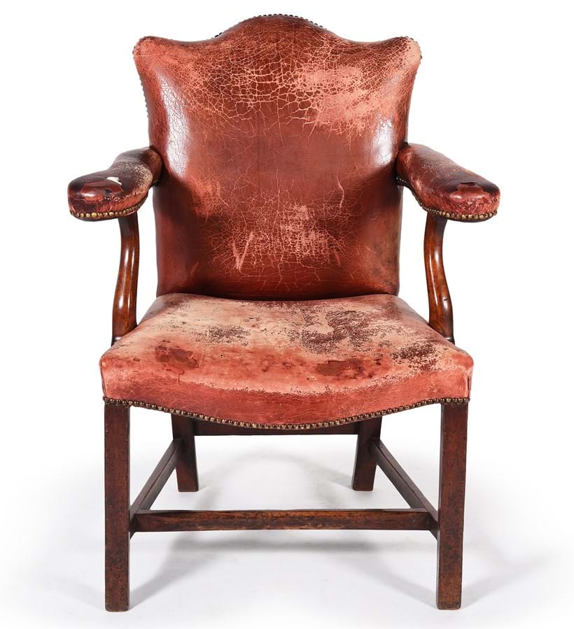Inline Image - Lot 487: A George III mahogany and leather upholstered open armchair, circa 1800 | Est. £500-800 (+fees)