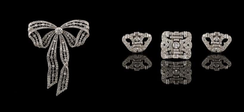 Inline Image - Lot 163: An Edwardian diamond and platinum bow brooch/pendant, circa 1910, Est. £4,000-6,000 (+fees) | Lot 166: An Art Deco diamond triple clip brooch, circa 1930 , Est. £8,000-12,000 (+fees)