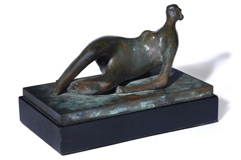 Inline Image - Lot 91: λ Henry Moore (British 1898-1986), 'Reclining Nude: Crossed Feet', Bronze with a green patina, mounted on a wooden base | Est. £60,000-80,000 (+ fees)