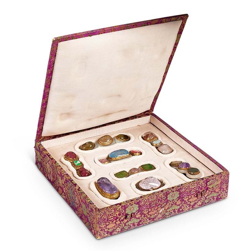 Inline Image - Lot 329: Eight various Chinese gilt-copper mounted semi-precious stone and jadeite buckles and brooches, Qing dynasty, 19th century | Sold for £30,000