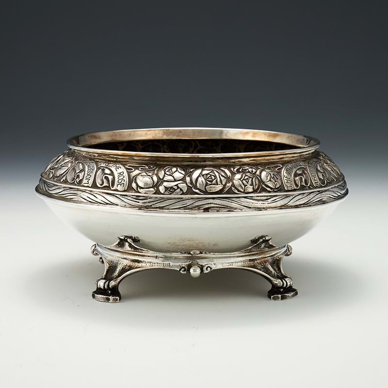 An Edwardian Arts and Crafts hammered silver rose bowl by Omar Ramsden & Alwyn Carr, London 1909