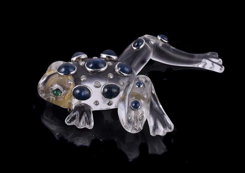 Inline Image - Lot 681: Seaman Schepps, a rock crystal, diamond, emerald and sapphire frog brooch | Est. £3,000-5,000 (+ fees)