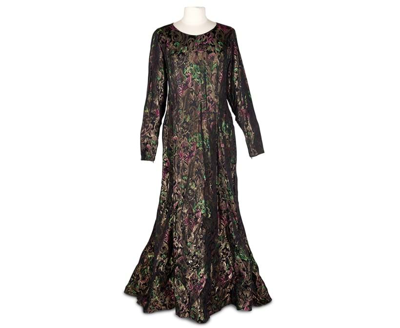 Inline Image - Dame Edith interest, an evening dress in gilt metal brocade shot with emerald green and pink on a black ground, mid 20th century | Est. £80-100 (+ fees)