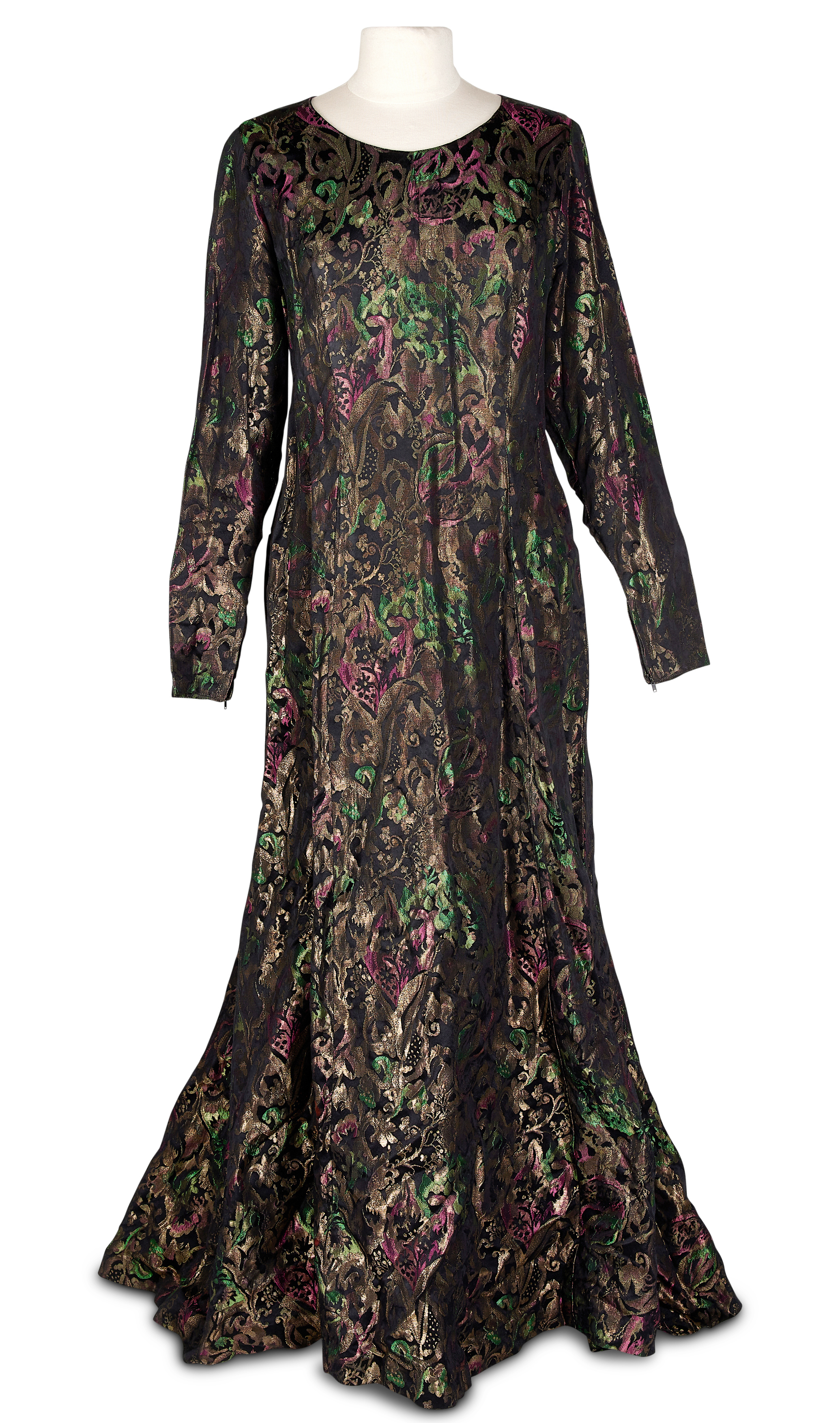 Inline Image - An evening dress in gilt metal brocade shot with emerald green and pink on a black ground,  mid 20th century | £80-100 (+ fees)