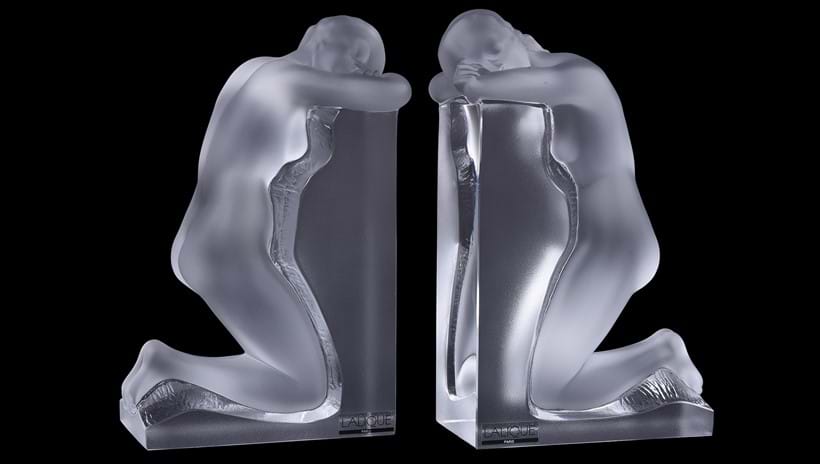 Inline Image - Lot 159: Lalique, Cristal Lalique, Reverie, a pair of clear and frosted glass figural bookends | Est. £800-1,200 (+ fees)