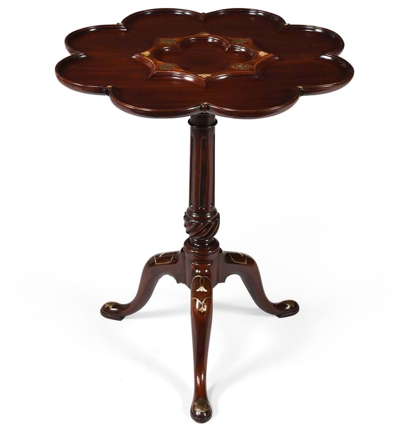Inline Image - Lot 192: A George II mahogany, brass and mother of pearl inlaid tripod table, attributed to Frederick Hintz, circa 1740 | Est. £8,000-12,000 (+ fees)