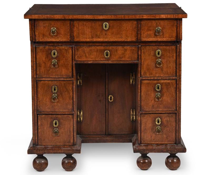 Inline Image - Lot 519: A Queen Anne walnut and feather banded kneehole desk, circa 1710 | Est. £6,000-8,000 (+ fees)