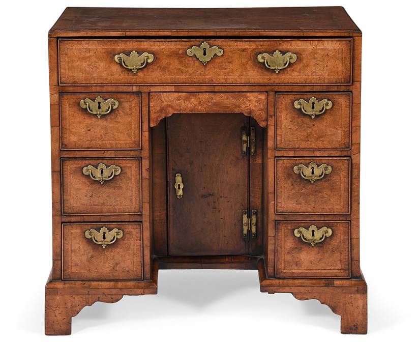 Inline Image - Lot 631: A George II burr walnut, walnut and feather banded kneehole desk, circa 1735 | Est. £3,000-5,000 (+ fees)