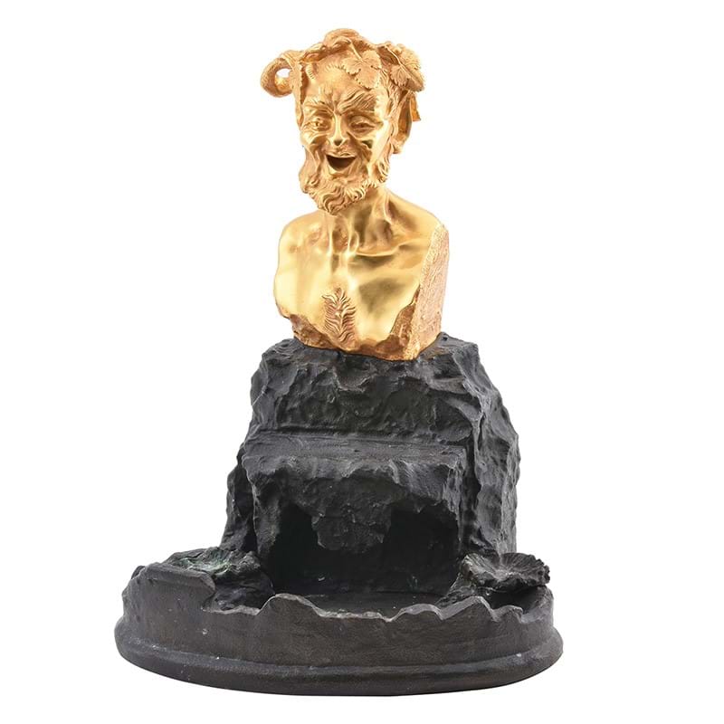 A patinated and gilt bronze inkwell, surmounted by a gilt bust of Bacchus