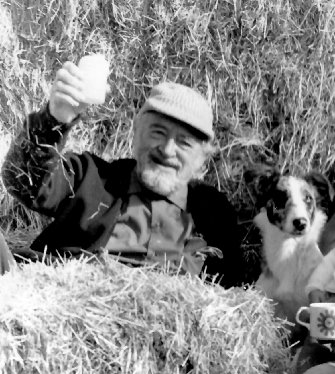 Hubert de Cronin Hastings, seated with his dog. Courtesy of the family..jpg