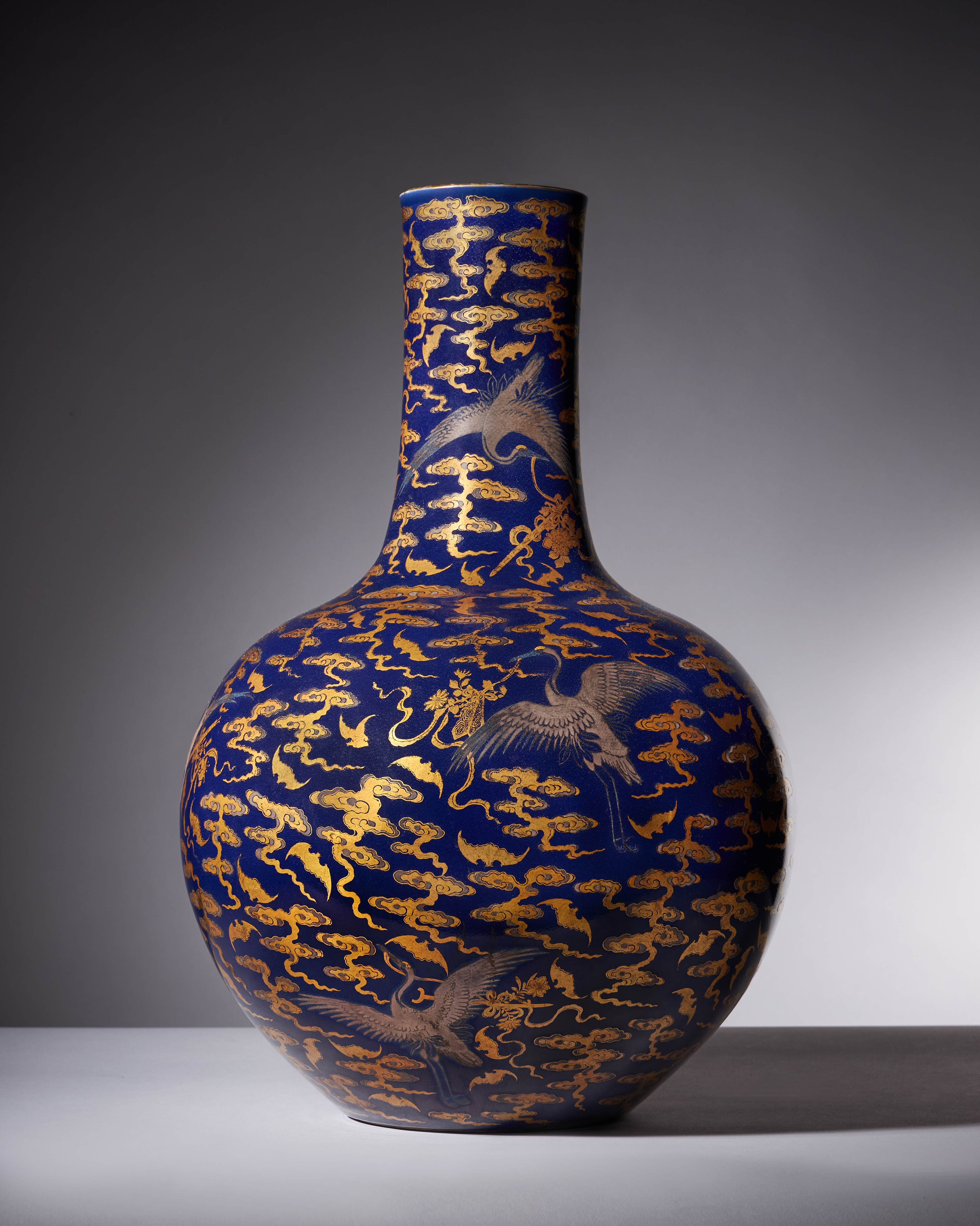 Inline Image - Lot 1: A Magnificent Chinese Imperial blue-glazed silver and gilt 'Bat and Crane' vase, Tianqiuping, seal mark and period of Qianlong | Sold for £1,449,000