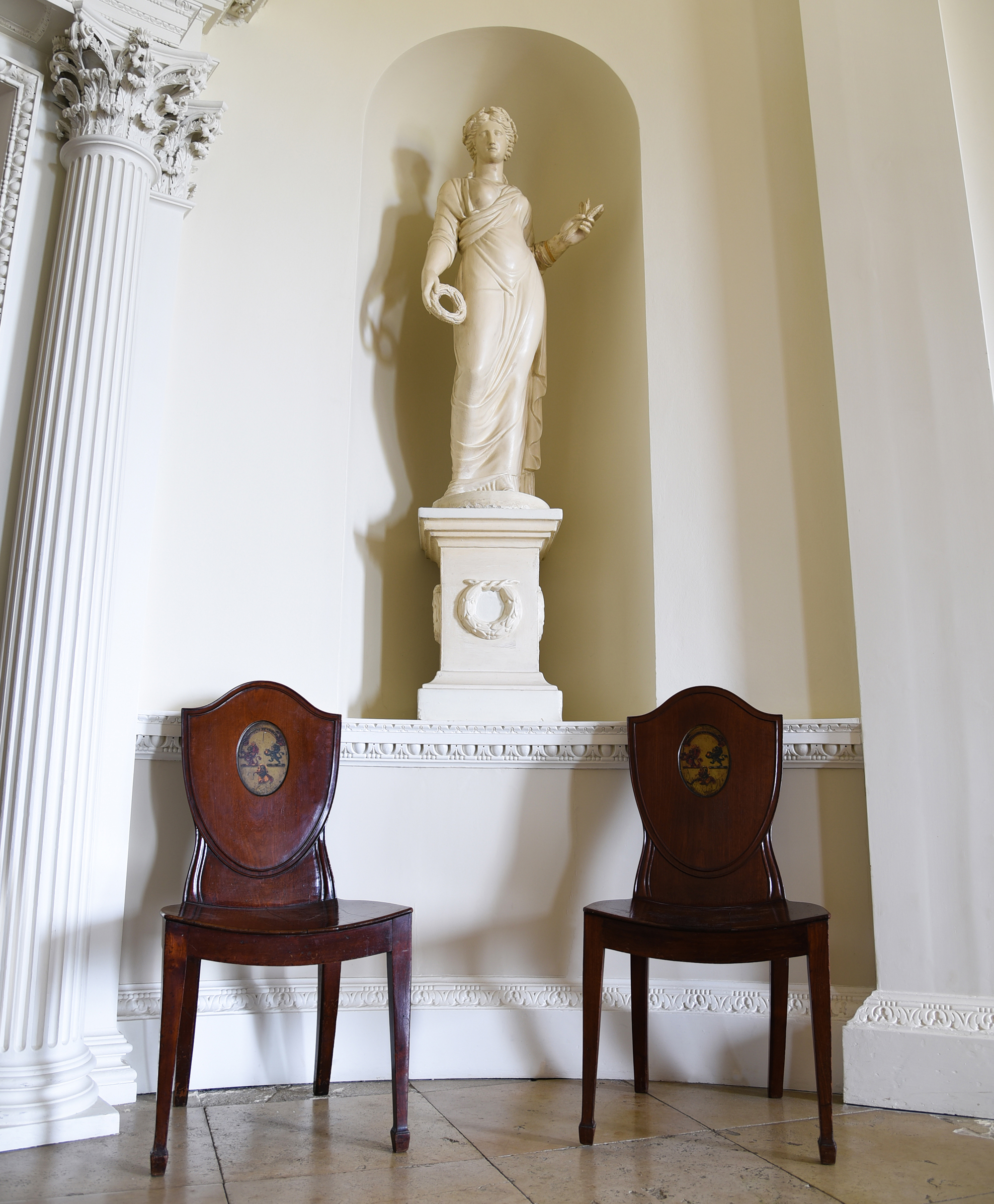 Inline Image - Lot 4: A set of nine George III mahogany hall chairs, circa 1780 | Est. £4,000-6,000 (+ fees)