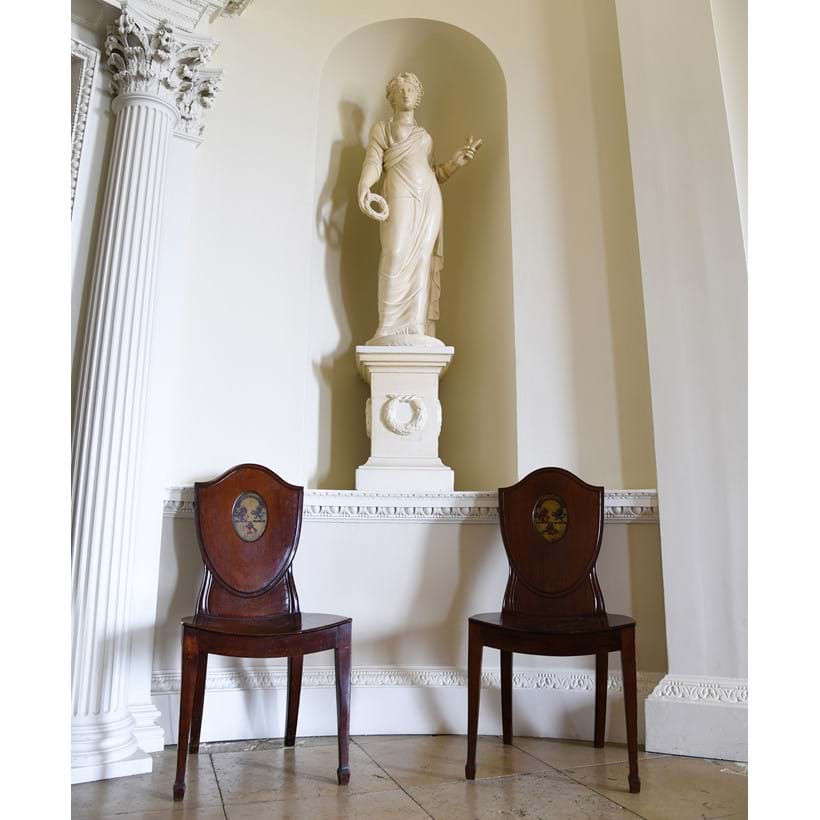 Inline Image - Lot 4: A set of nine George III mahogany hall chairs, circa 1780 | Est. £4,000-6,000 (+ fees)