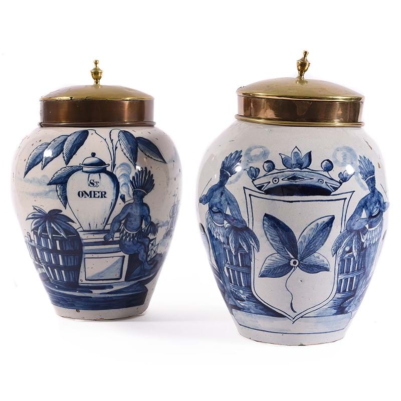 Two similar Dutch Delft tobacco jars and two gilt metal covers, late 18th or 19th century 