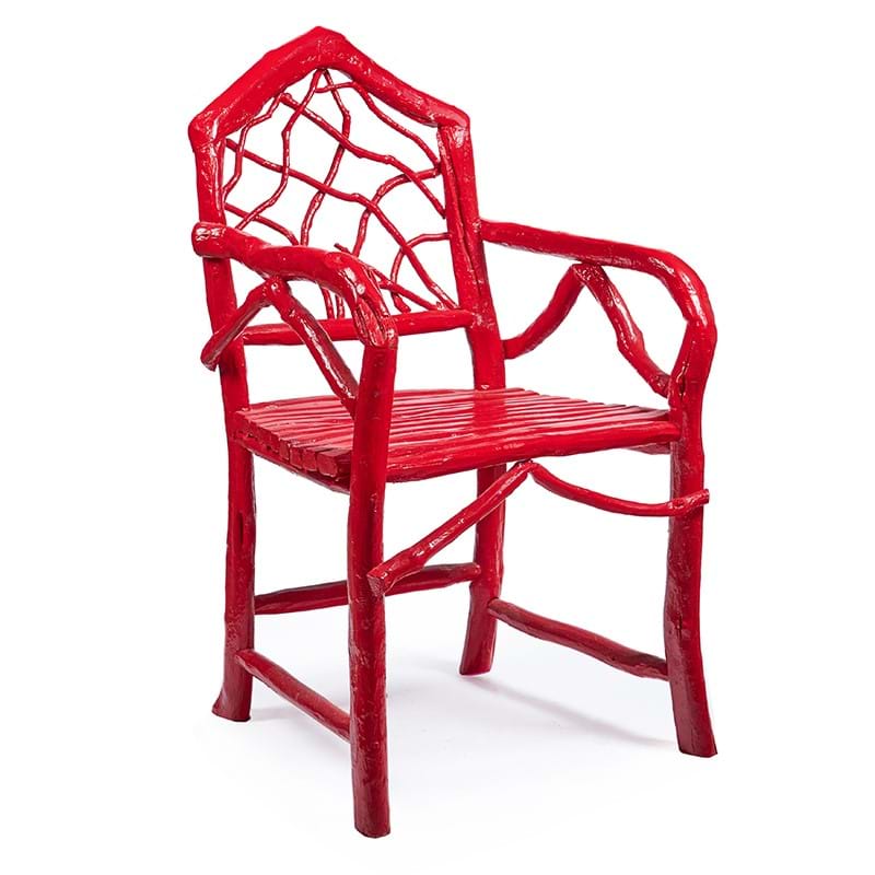A Moroccan red painted root-form open armchair, 20th century, designed by Christopher Gibbs