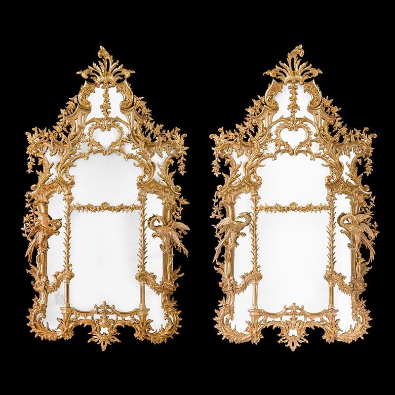 A pair of monumental carved giltwood pier mirrors, late 18th or 19th century